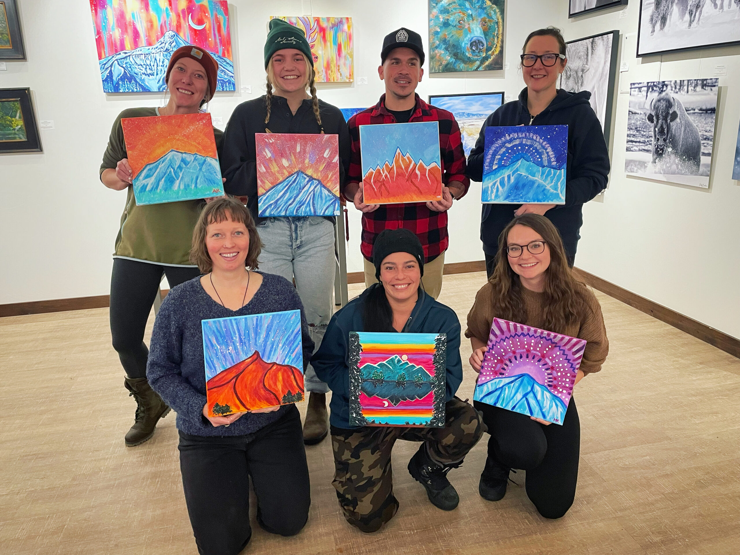 Participants holding their artwork